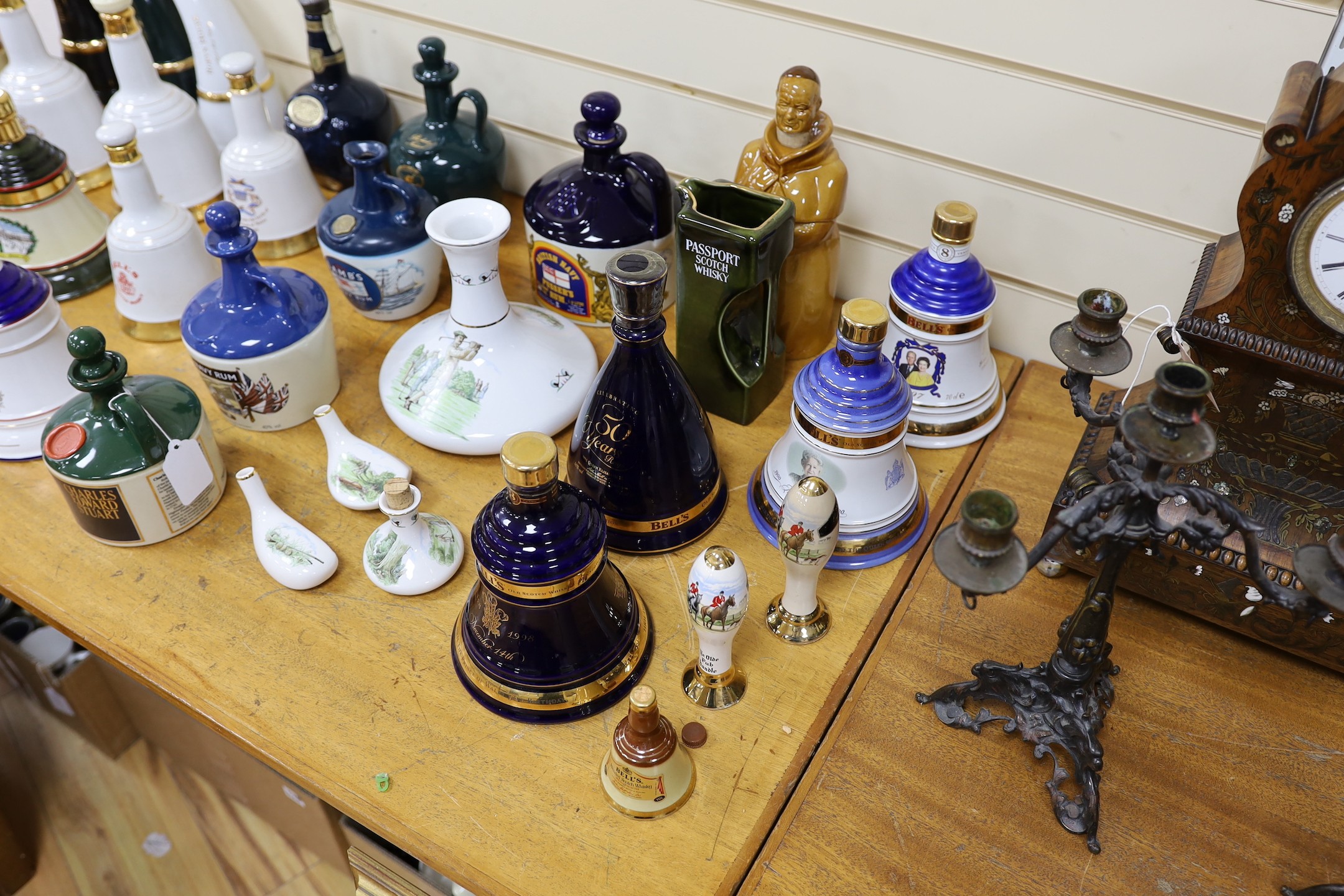 Four Wade commemorative porcelain 70cl bottles of Bells whisky, a miniature porcelain bottle of bells whisky, two miniature ‘beer pump’ bottles of mead and a large quantity of empty porcelain decanters